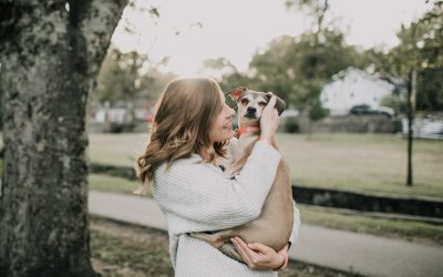 woman hugging her cute dog